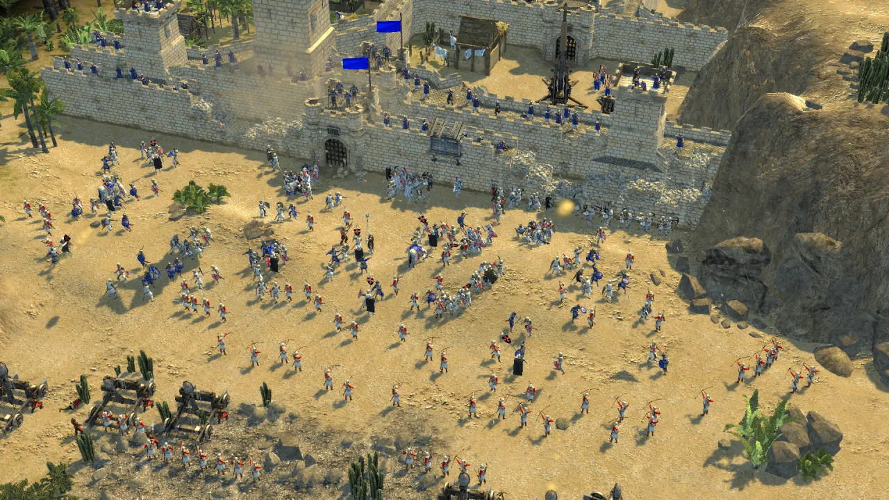 Outside the desert castle, a great army besieges the walls, with catapults and archers engaged in fierce combat